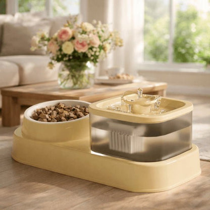 Fontaine combinant eau filtrée et gamelle de croquettes pour chat dans un intérieur lumineux
